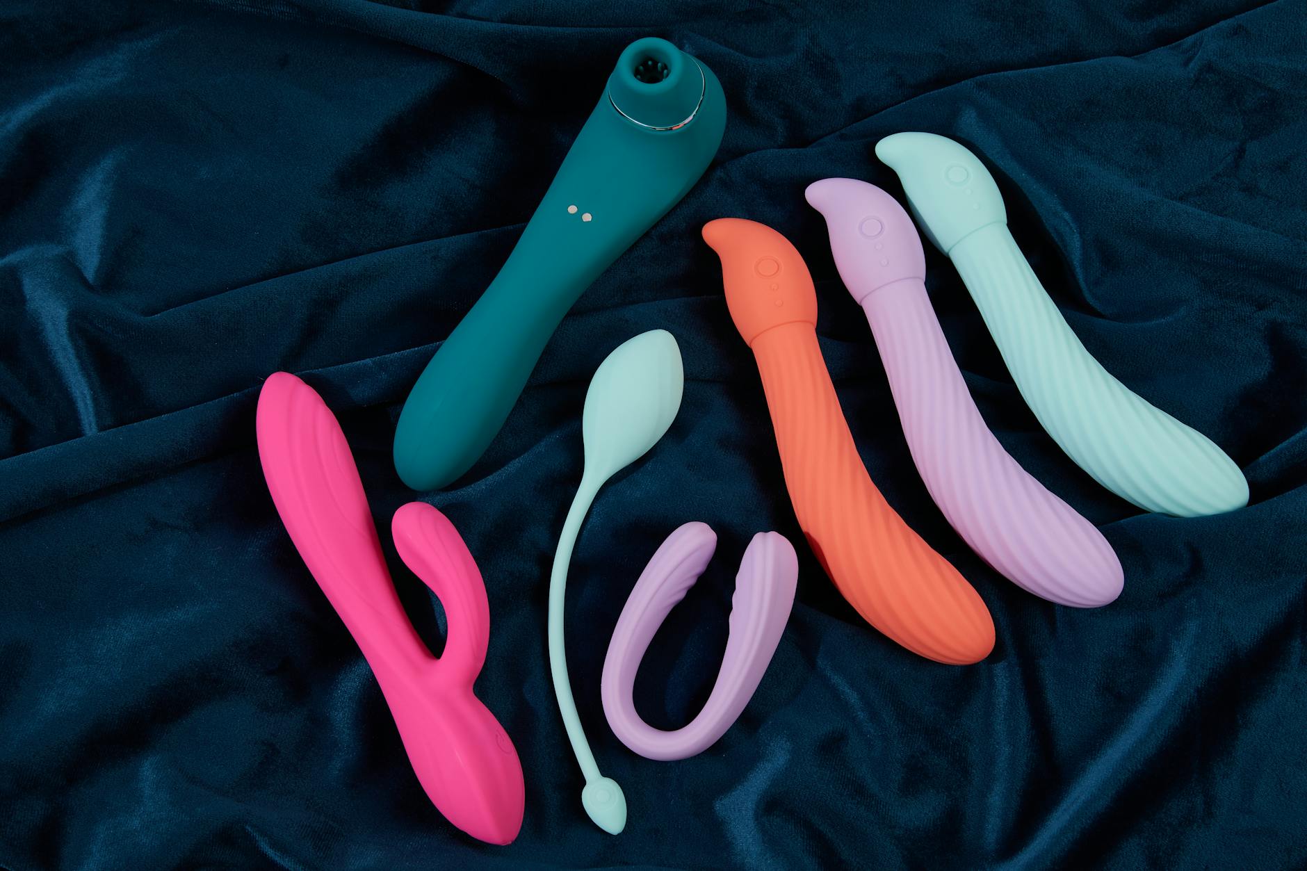 Yellow lemon vibrator on a bright yellow background with fresh fruit