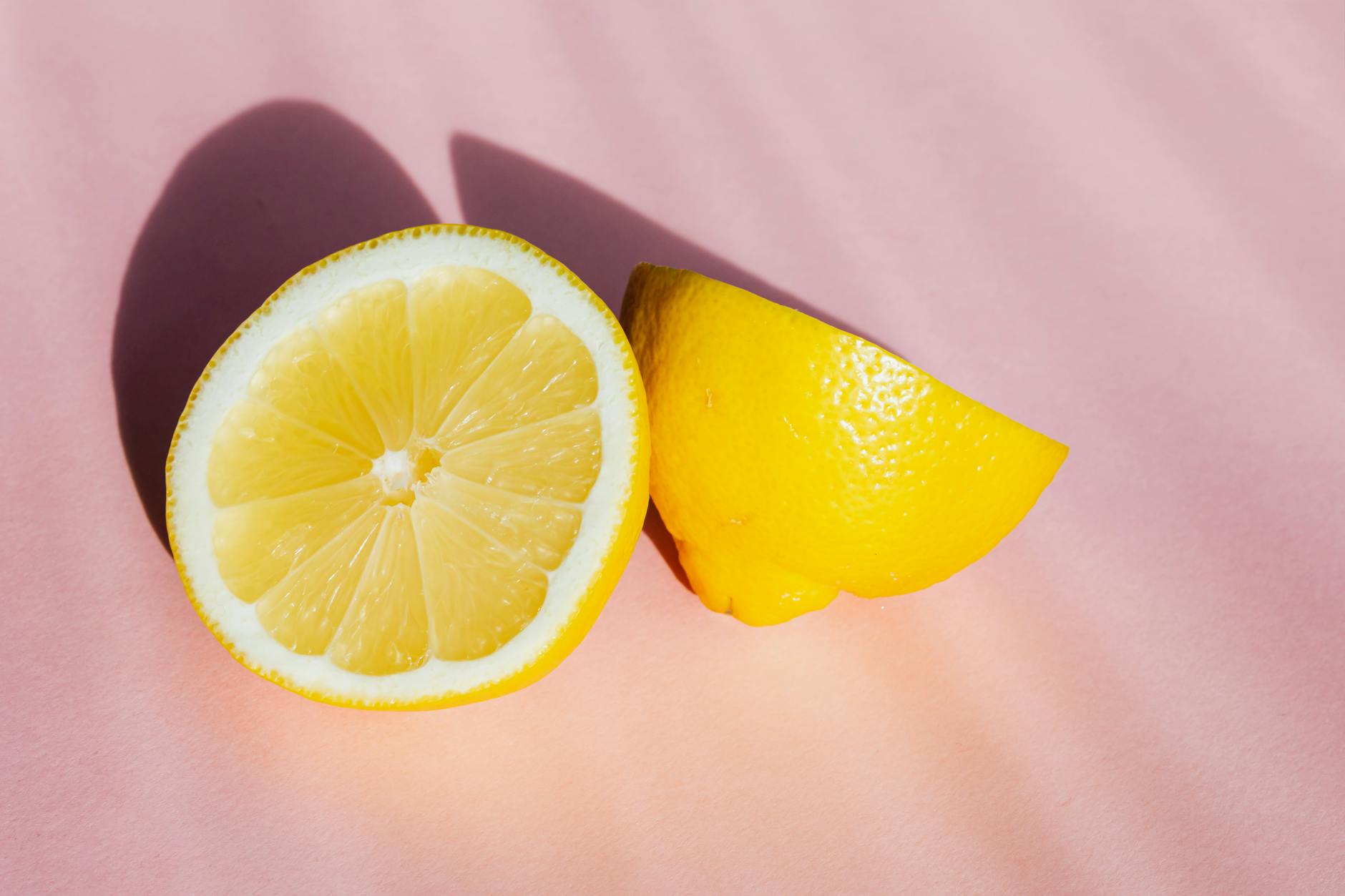 A yellow silicone vibrator surrounded by peeled bananas on a yellow background