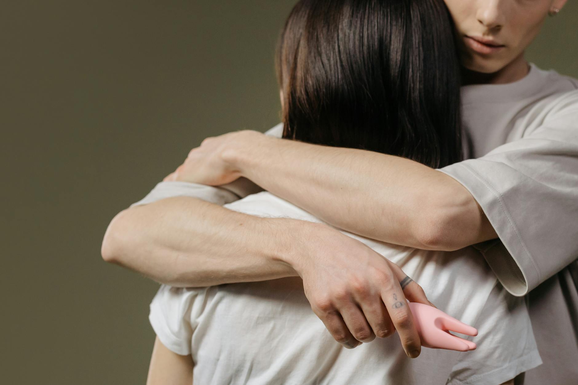 Close-up of a couple embracing, highlighting intimacy and connection during pregnancy.